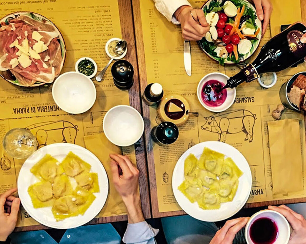 La Salsamenteria di Parma table of pasta, parma ham and wine